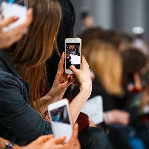 People taking pictures on their phones