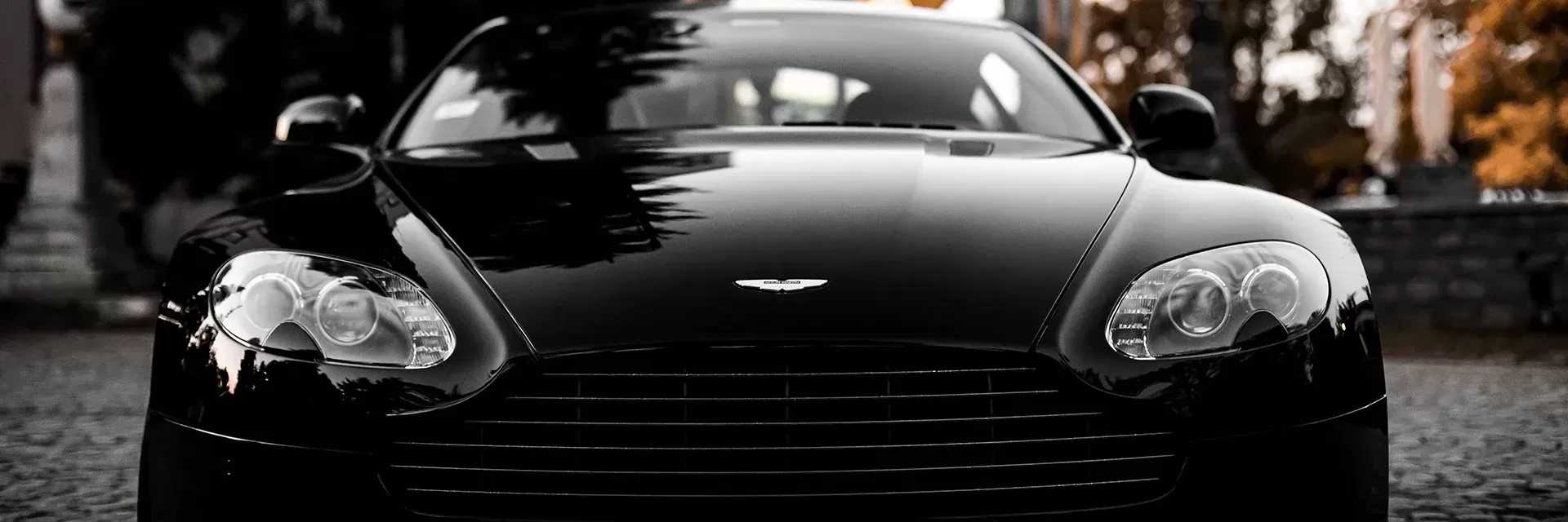 Front of black Aston Martin sports car