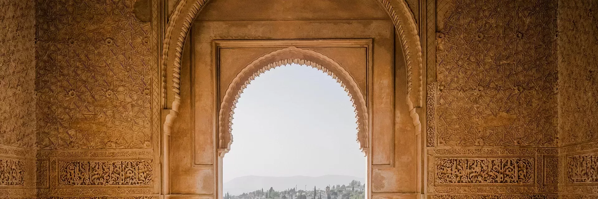 Arched ancient wall with view of city