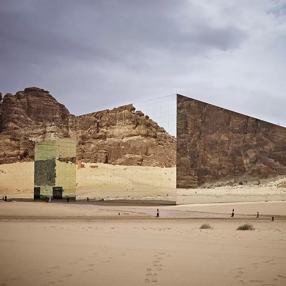 Large silver, mirrored exterior of square building in Al Ula, SAUDI ARABIA