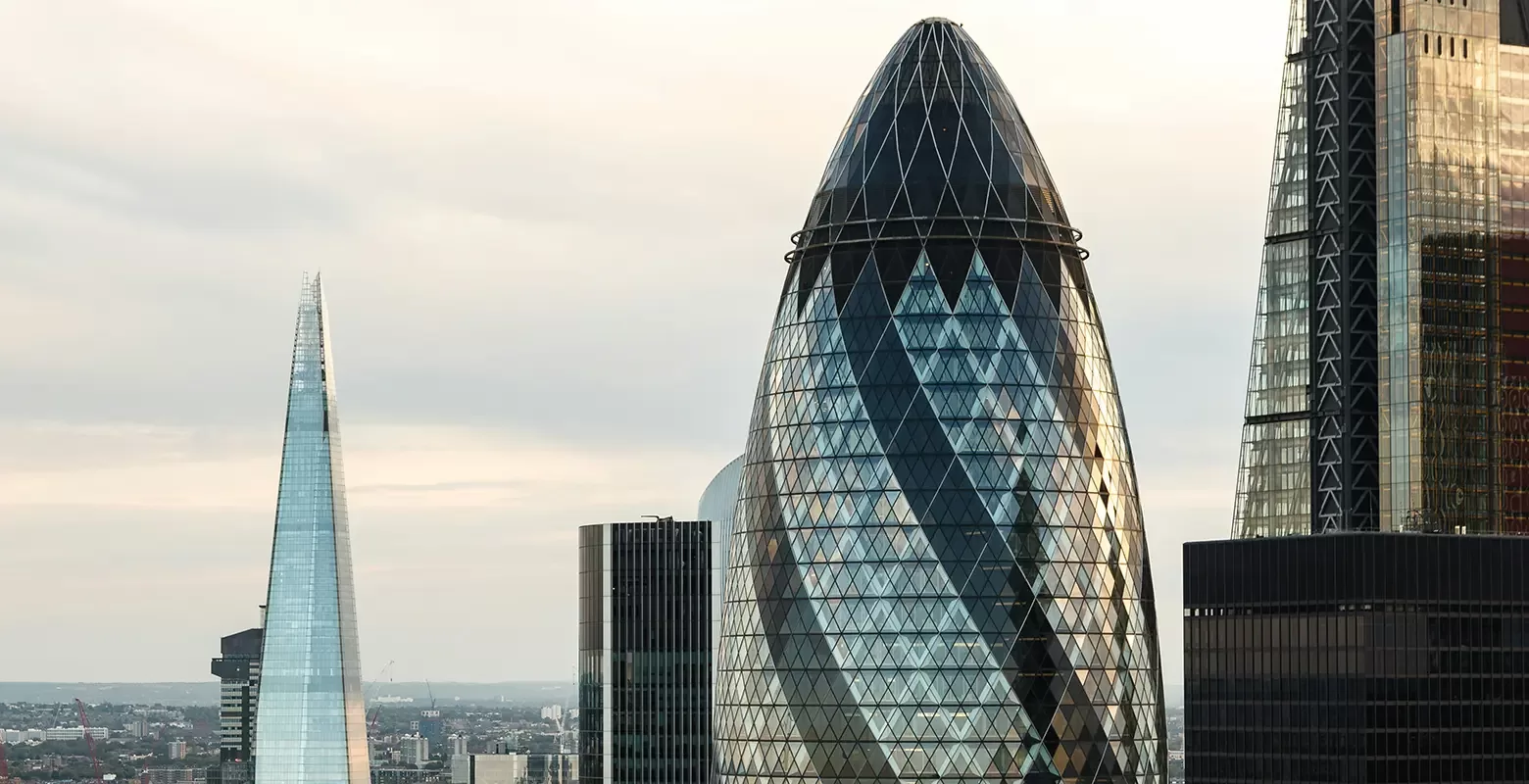 London city skyline showcasing the top of the Shard and Gherkin landmarks.