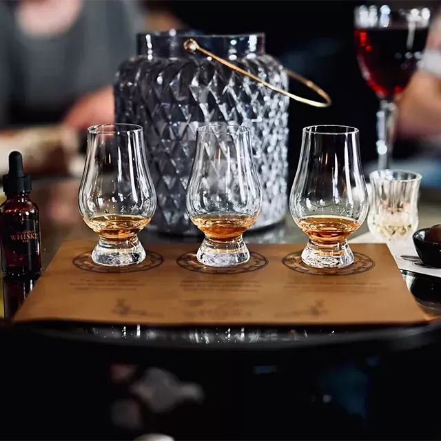 Hennesy glasses with liquor in them on a table
