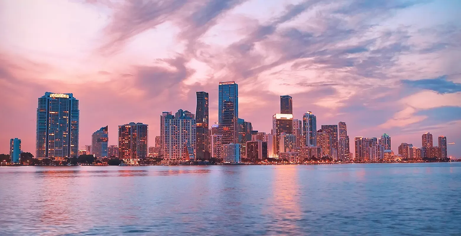 Beautiful pink-tinted Miami skyline with the sky filled with shades of pink.