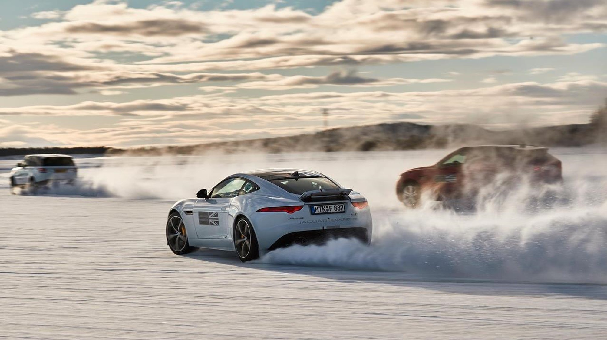 Sports cars racing in desert