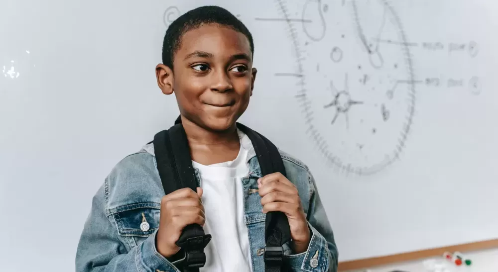 Young boy wearing a rucksack