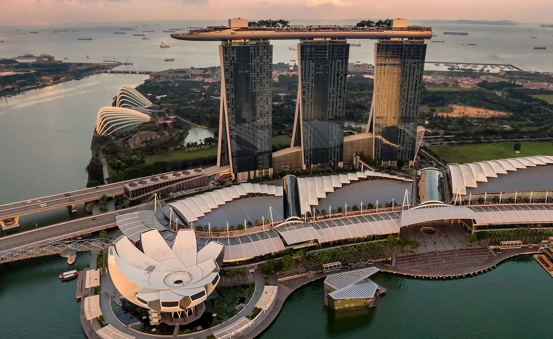 Birdseye view of Singapore featuring Marina Bay Sands, Singapore's luxurious hotel, recognized as the world's most expensive, featuring stunning modern architecture.