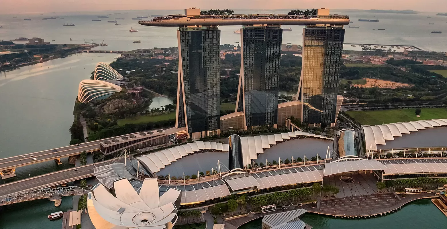 Birdseye view of Singapore featuring Marina Bay Sands, Singapore's luxurious hotel, recognized as the world's most expensive, featuring stunning modern architecture.