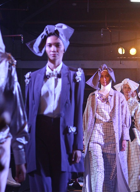 Models walking down runway at London Fashion Week