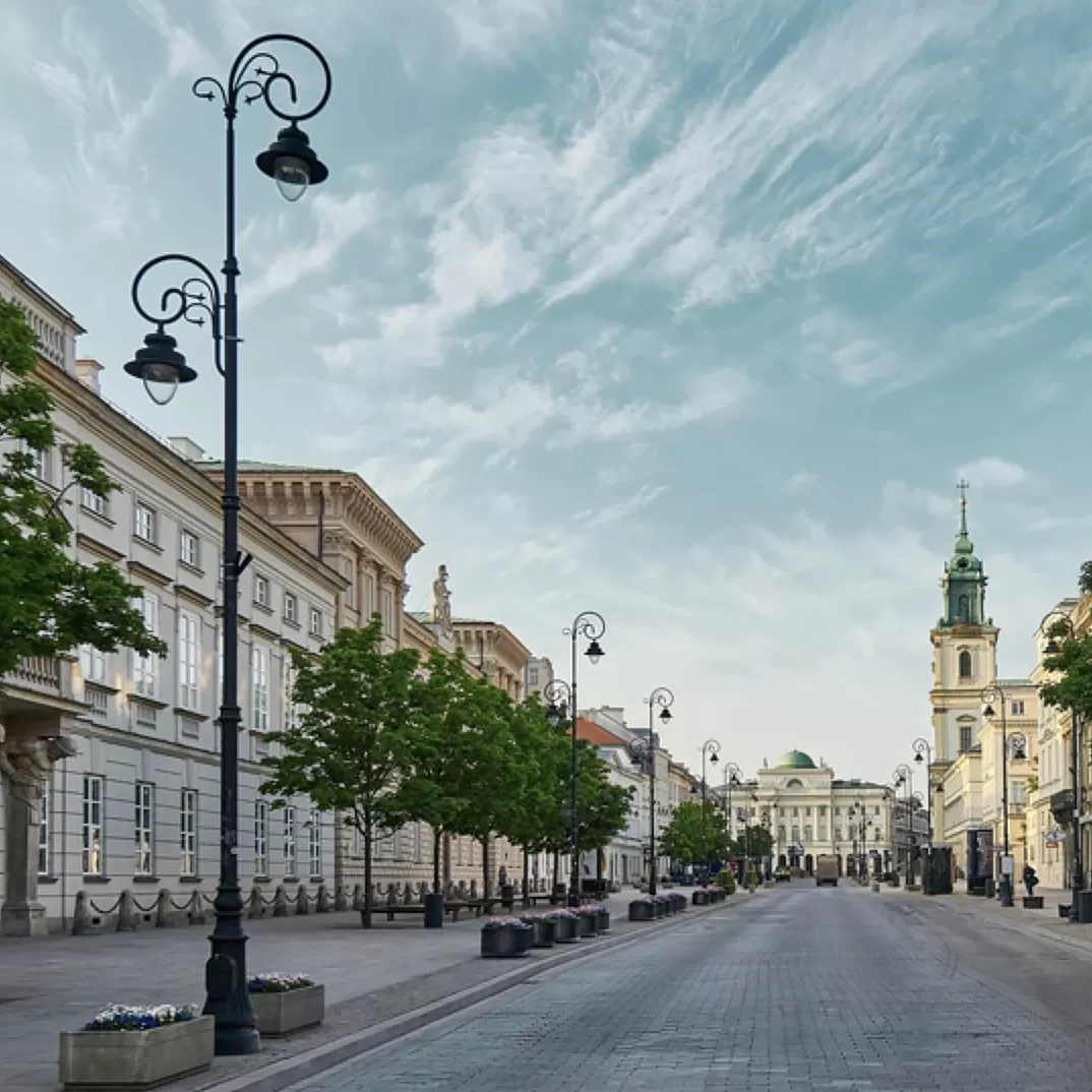 Cobbled highstreets with tall buildings at The Raffles patisserie in Warsaw