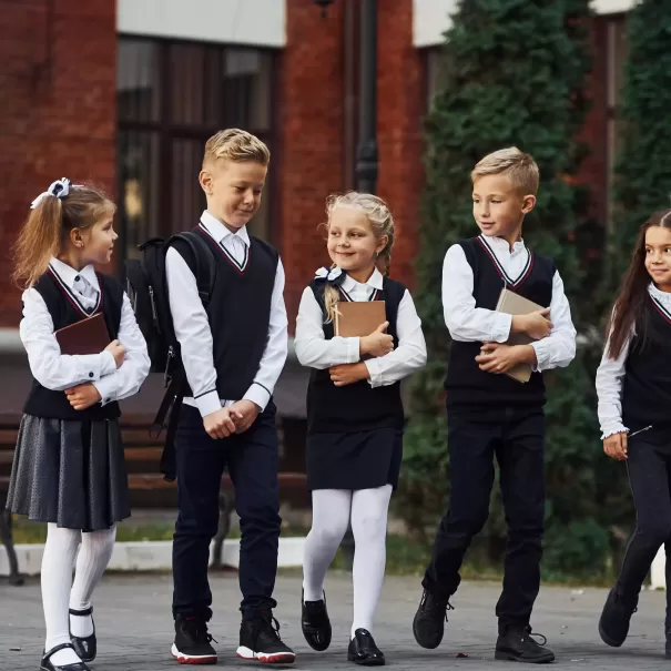 Children in school uniform walking together