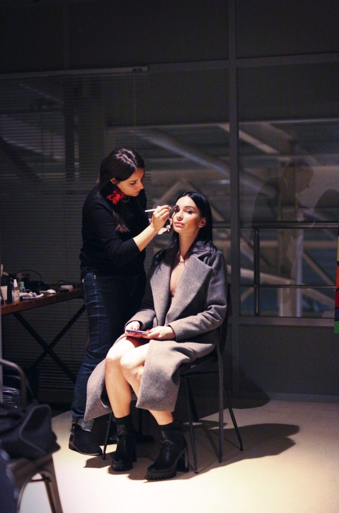 Model getting her hair and makeup done