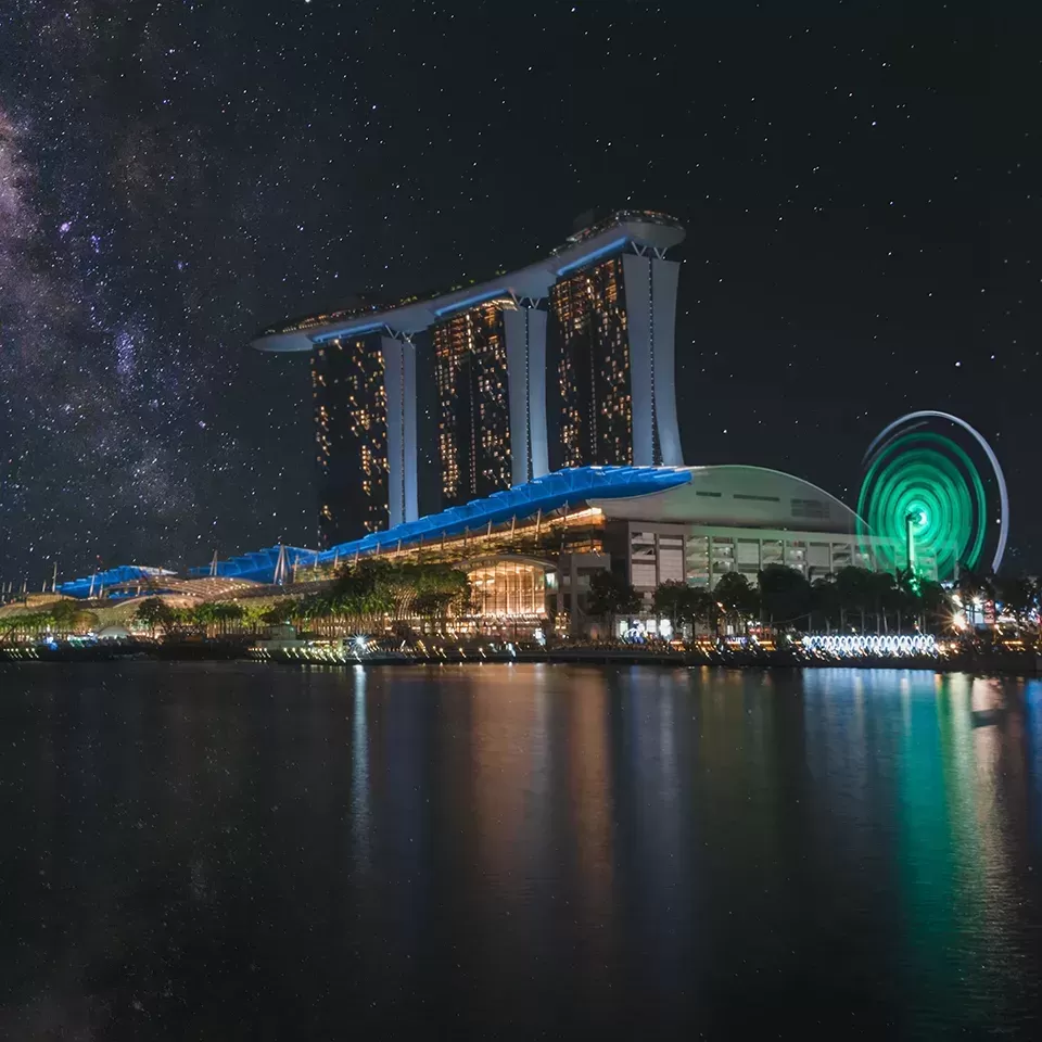 View of Singapore City at night and the famous Marina Bay SandsSingapore hotel from across the river