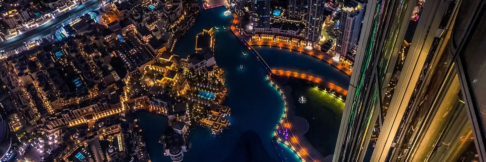 Birdseye view of the city of Dubai lit up at night