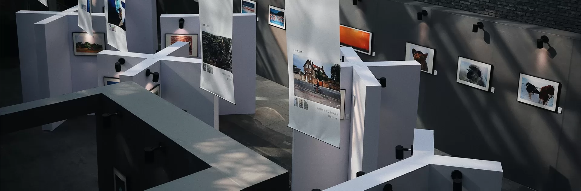 A large room featuring an array of pictures on the walls, enhancing the visual appeal of the space.