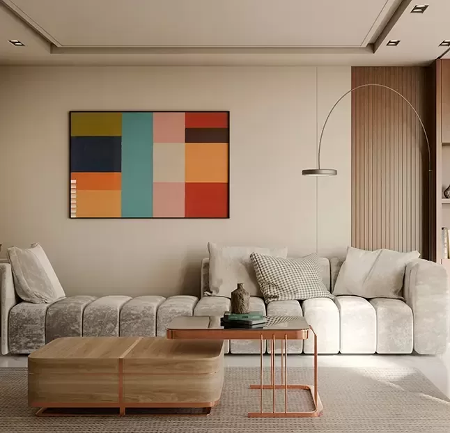 A cozy living room featuring a couch, a coffee table, and a decorative painting on the wall.