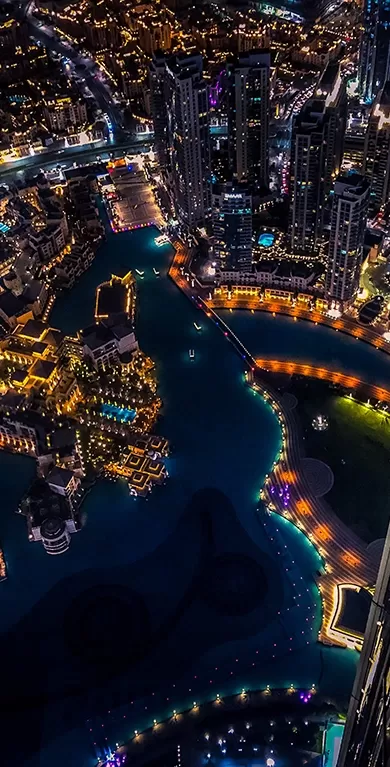 Birdseye view of the city of Dubai lit up at night