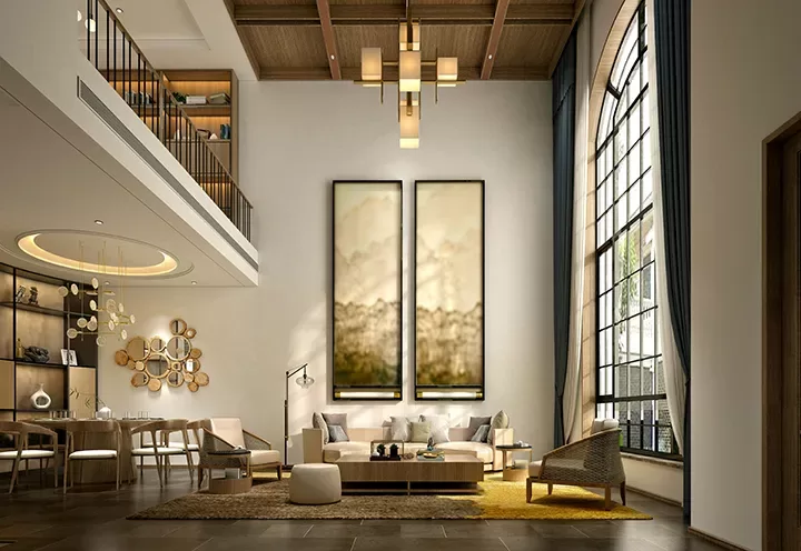 Modern living room with high ceilings, large arched window, and neutral-toned furniture. Abstract art hangs above a beige sofa; dining area with wooden table and chairs is visible in the background. Natural light fills the space.