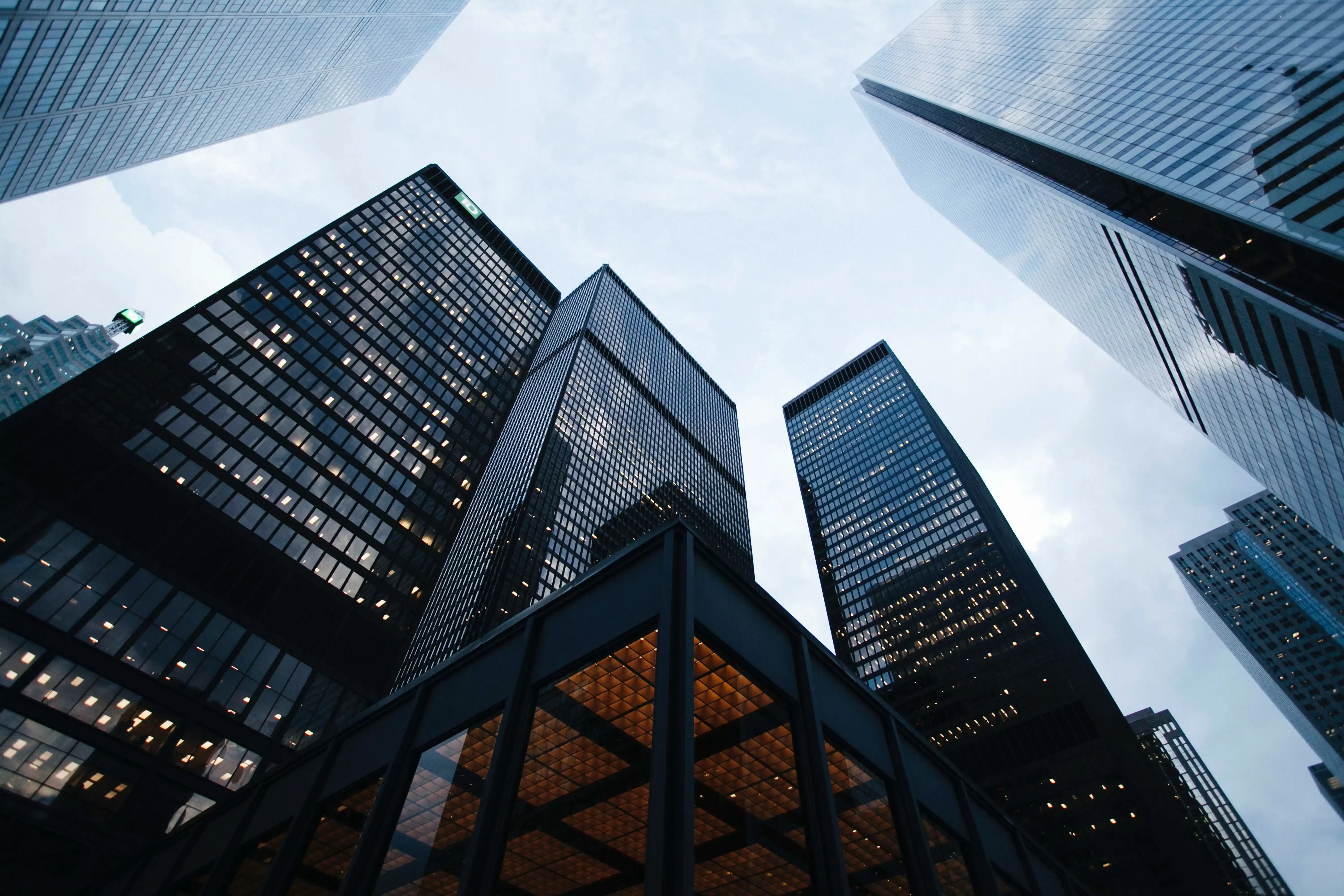 Looking up at tall city buildings photo taken by Sean Pollock