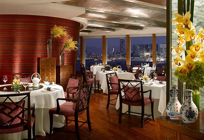 Luxury interior of dining tables and chairs at restaurant Lung King Heen located in the Four Seasons, Hong Kong