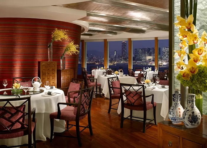 Luxury interior of dining tables and chairs at restaurant Lung King Heen located in the Four Seasons, Hong Kong