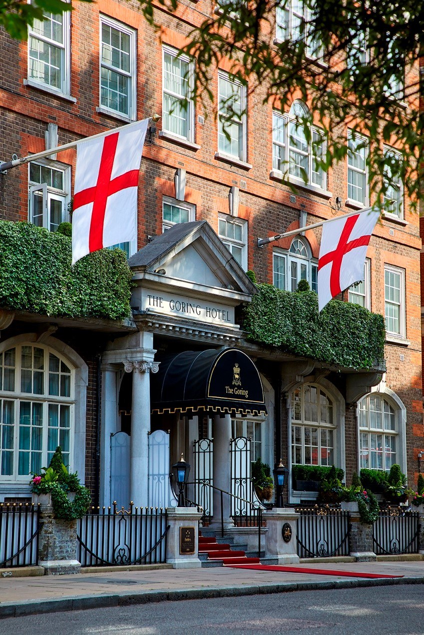 Outside luxury town house building with England flags at The Goring Belgravia