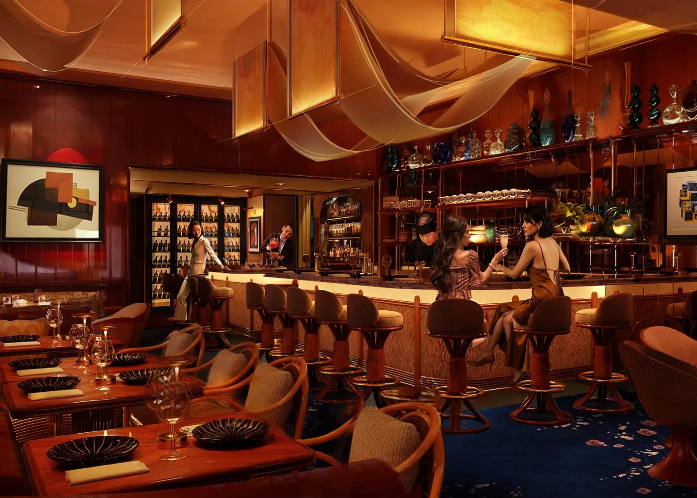 A stylish, warmly lit bar with elegant decor, featuring patrons seated at the bar and staff behind it. The space includes wooden tables with place settings, plush chairs, hanging drapes, and decorative bottles on shelves.