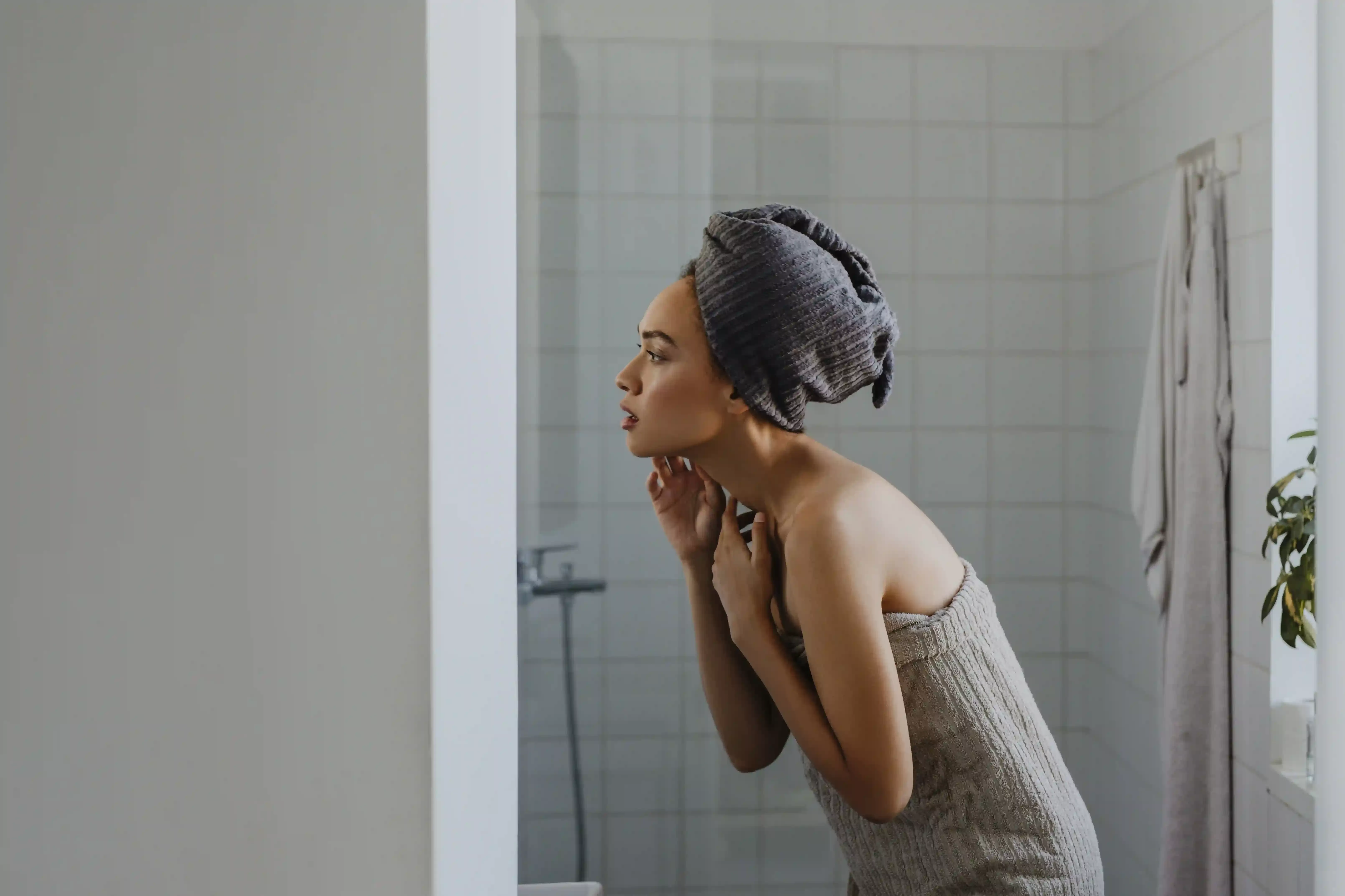 Women in towels in a bathroom