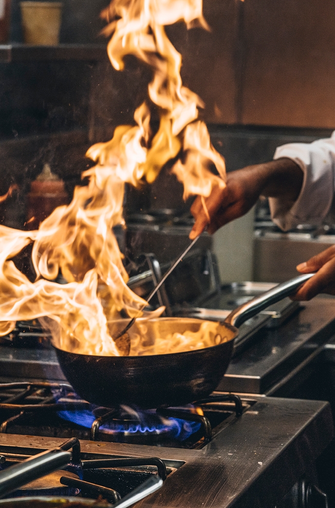 Cooking food in a fire pan at Benares