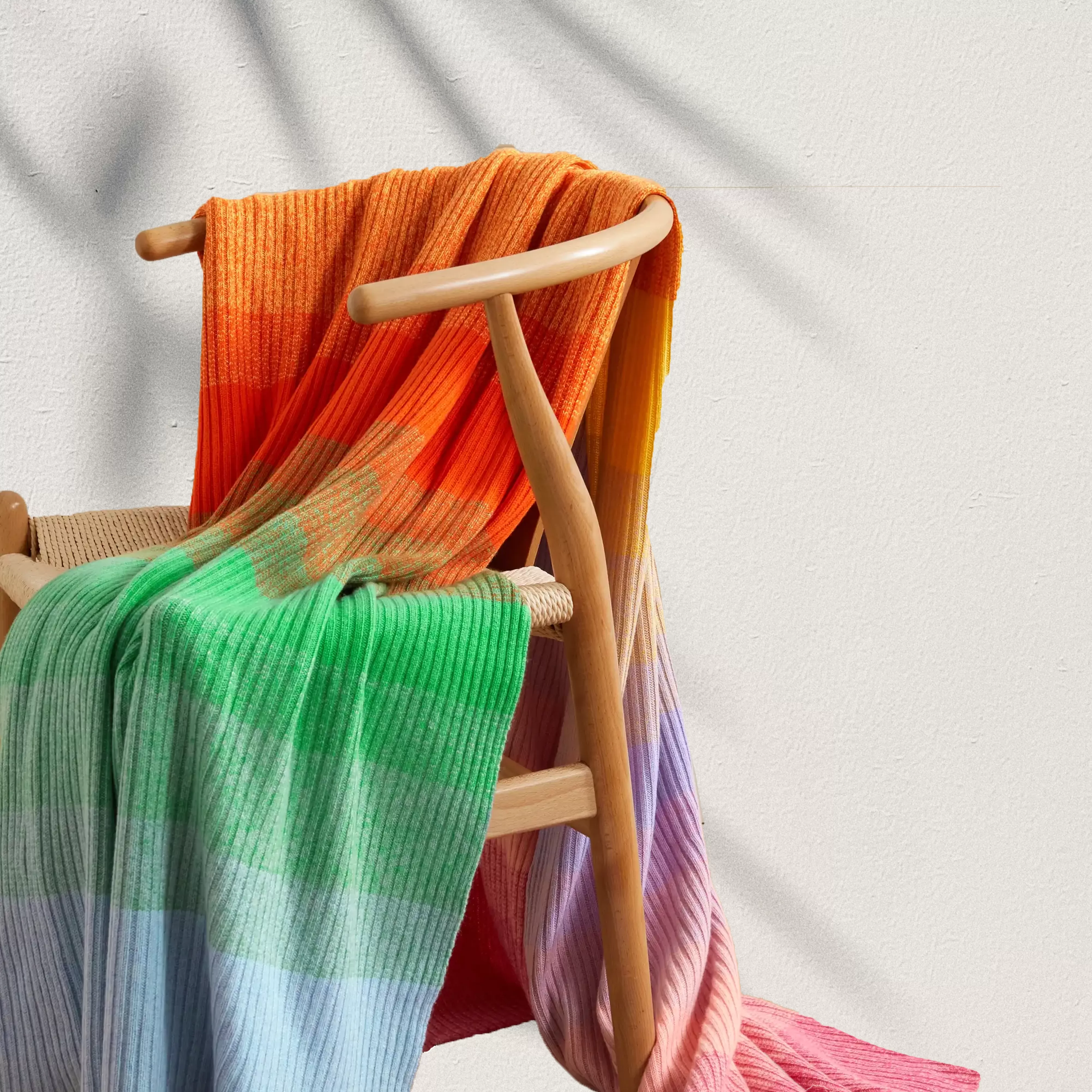 Elder Statesman hand-knitted cashmere blanket on artistic backdrop