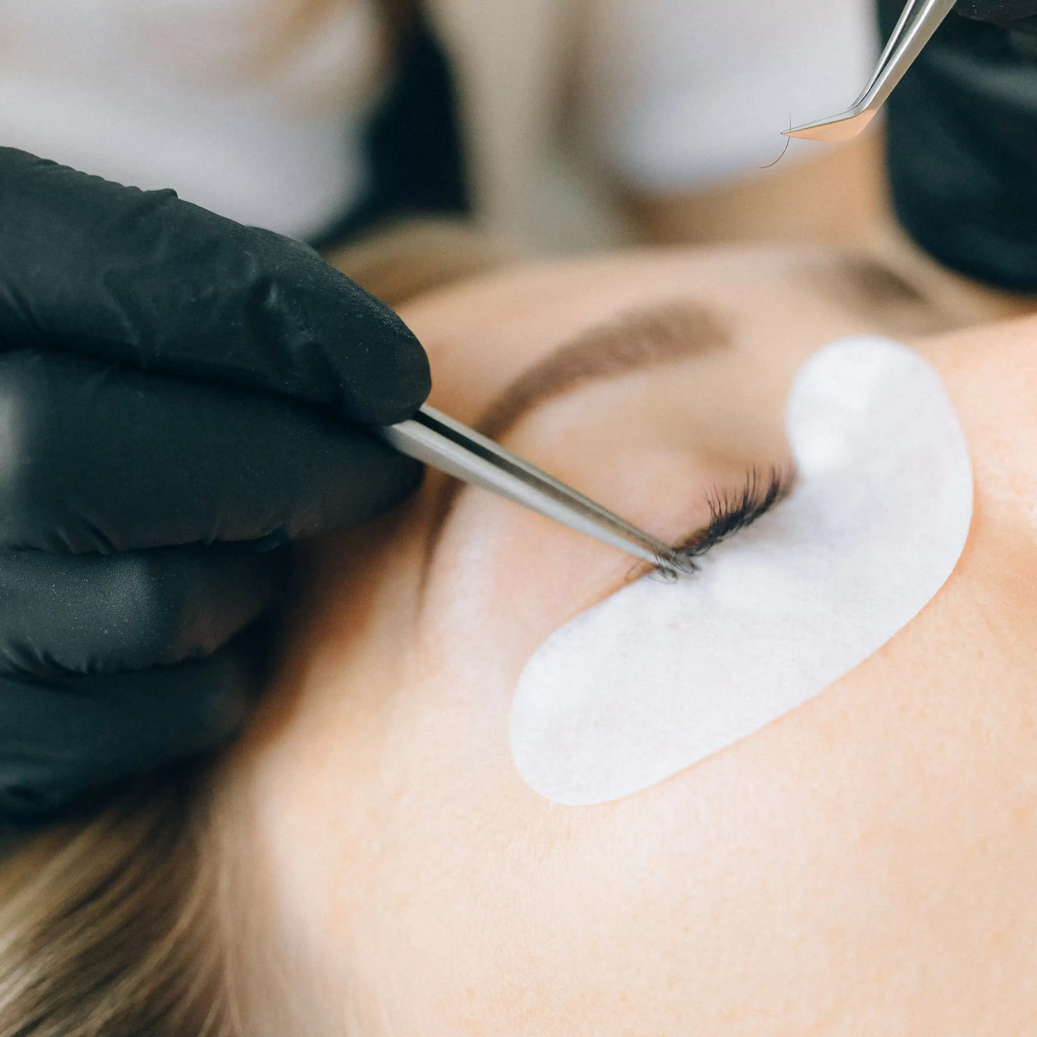 Women receiving Lynk-Gel Lash Extensions by Camilla Kirk Reynolds