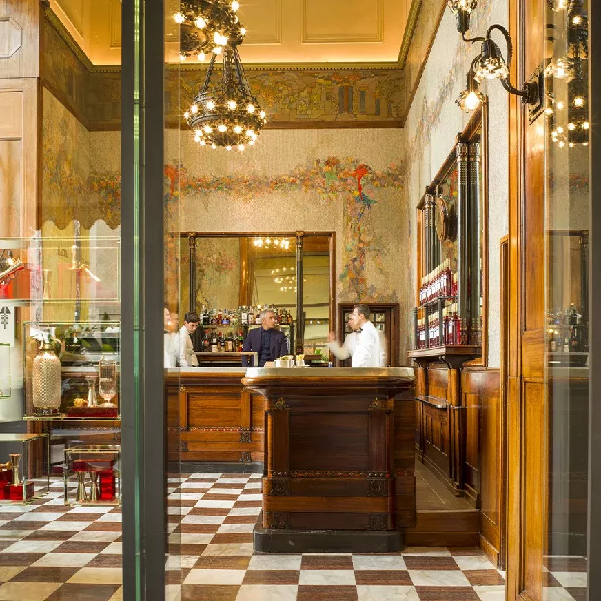 Inside retro-vintage style bar with checkered floor at Camparino in Galleria