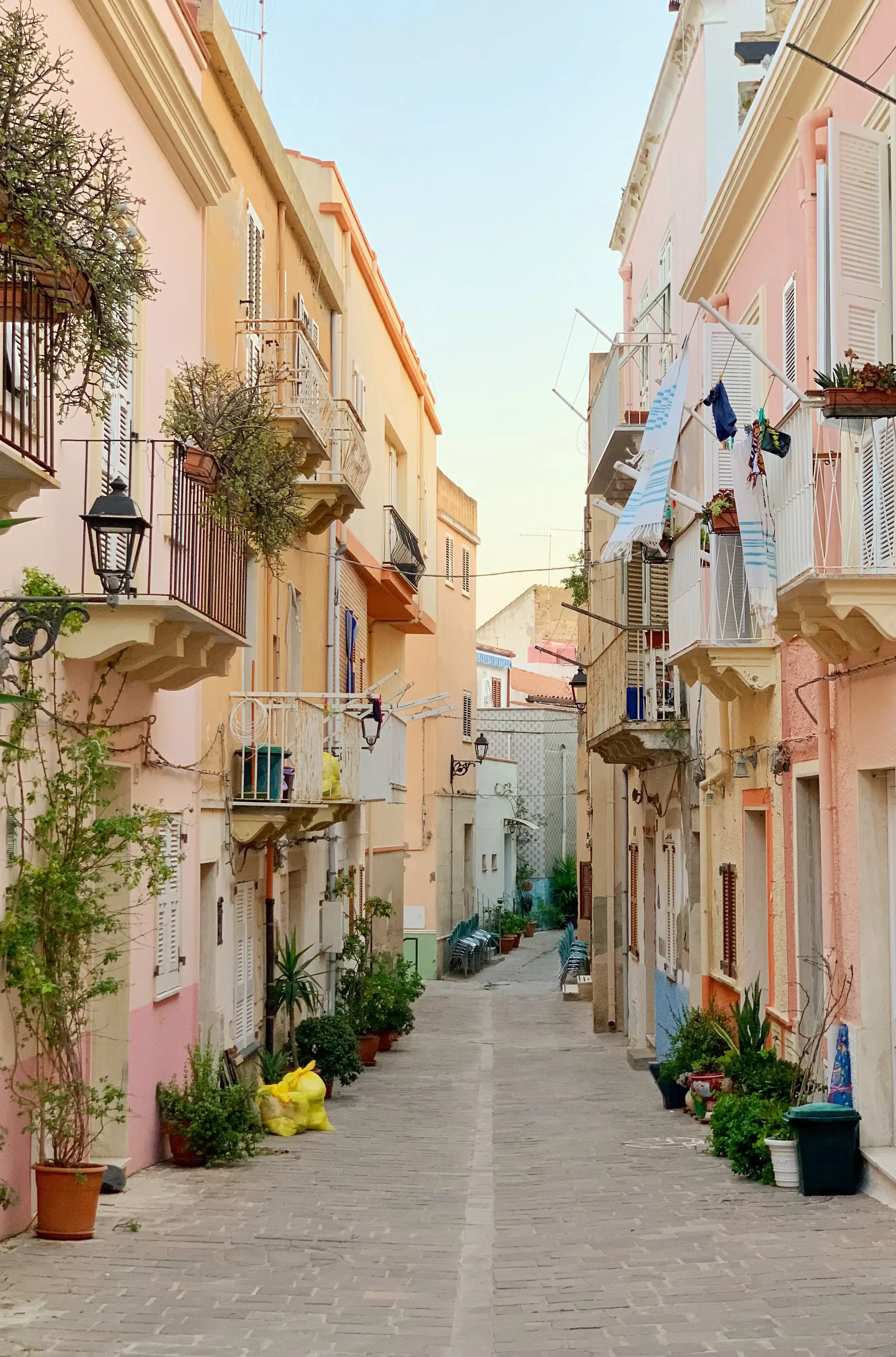 Carloforte residential area with narrow streets and pastel building in Isola di San Pietro, Italy