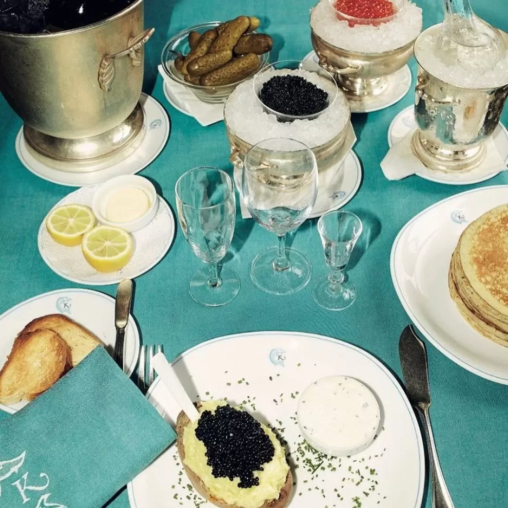 Spread of food with several types of caviar and twice-baked potato at Caviar Kaspia, London
