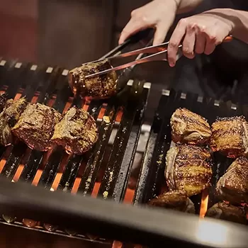 Meat being cooked on open fire at Decimo at The Standard, Kings Cross, London