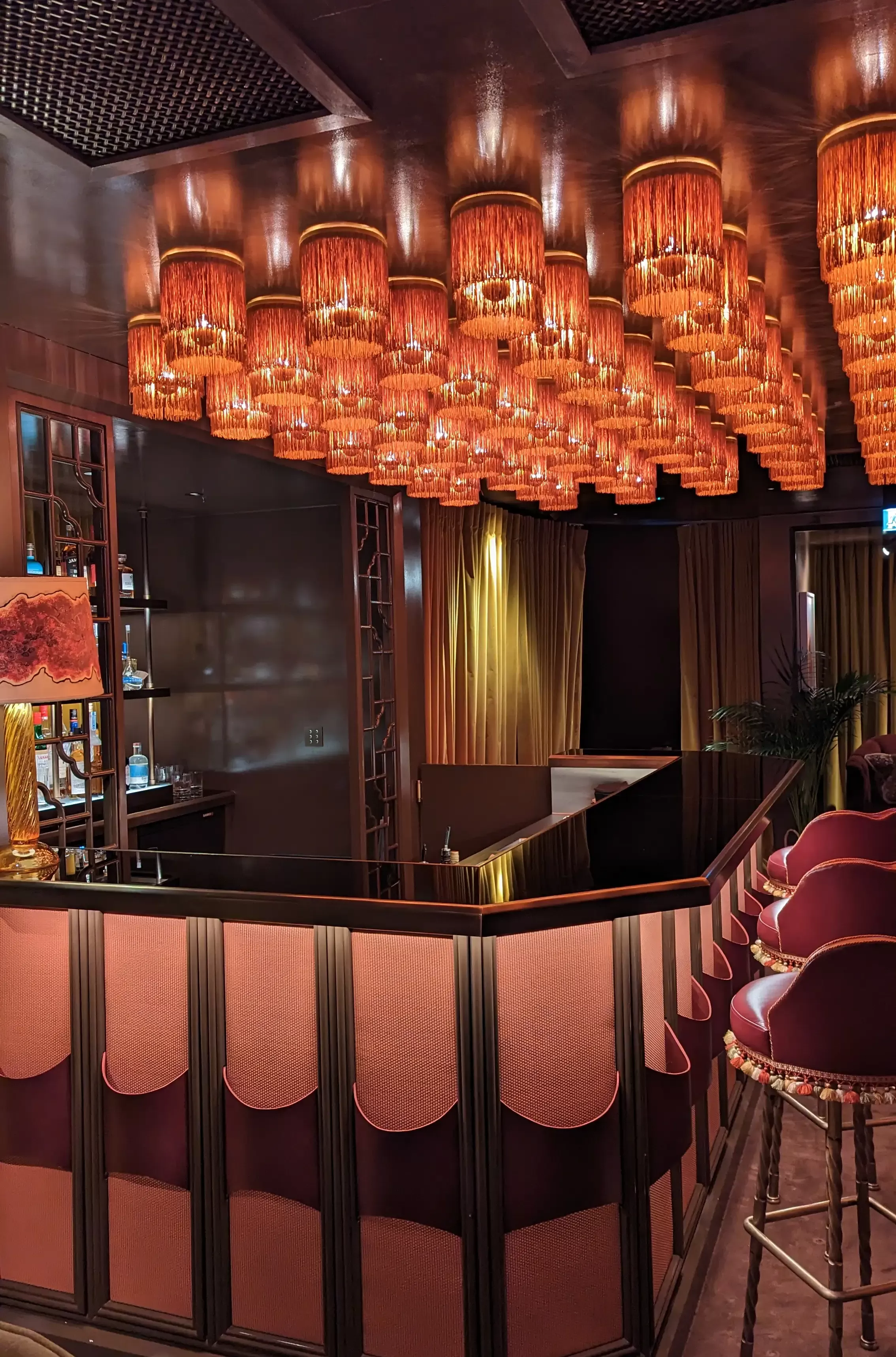 Erotic trims in deep burgundy and gold lit bar The Games Room at Mount St. Restaurant, Mayfair, London