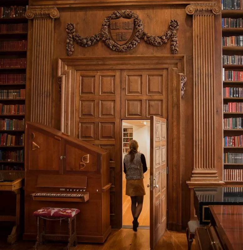 Women walking through library at Harvard University