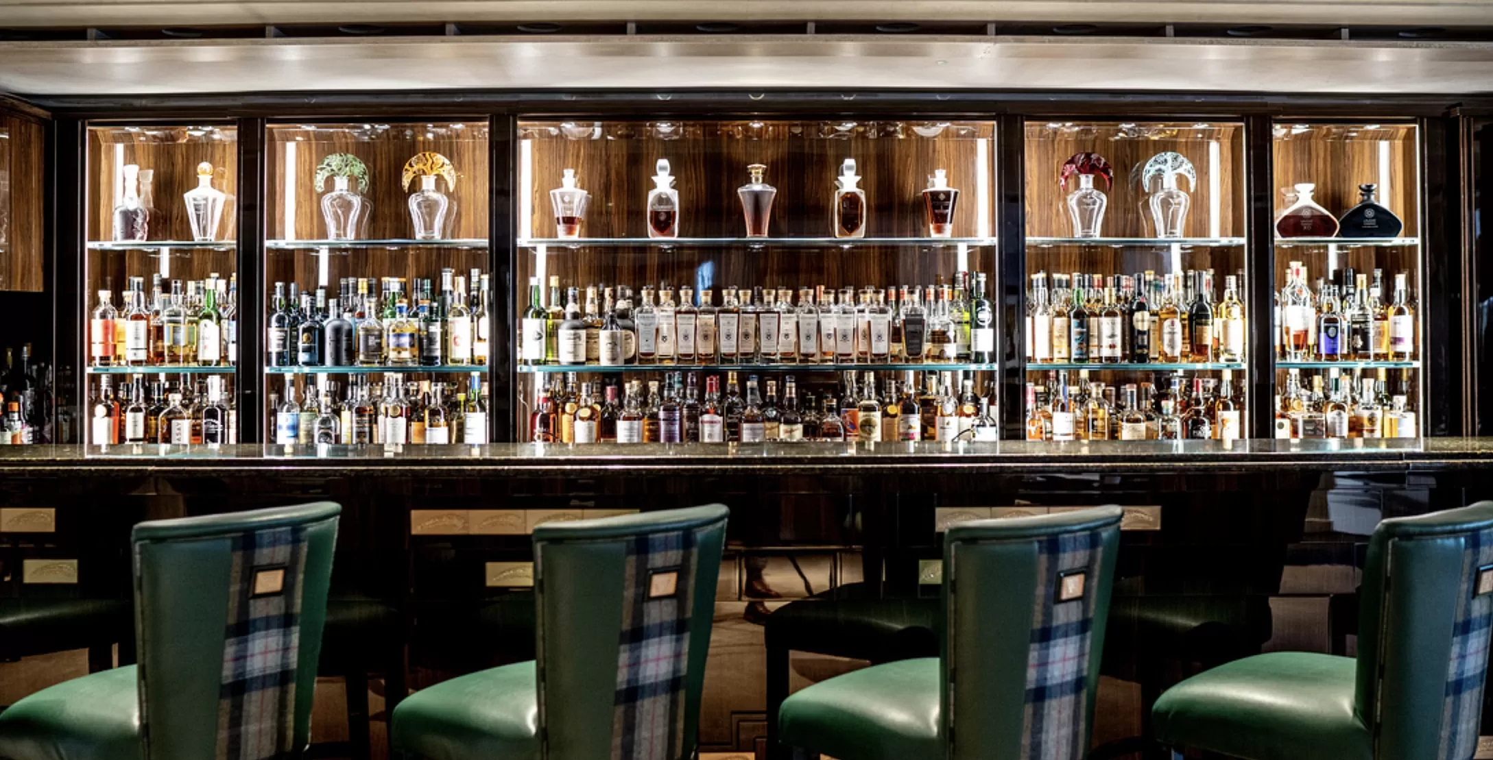 Luxury bar interior with tartan leather bar chairs in Scotland