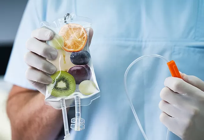 Doctor holding IV drip full of fruit