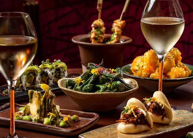 Display of colourful Purivian brunch dishes served with champagne at COYA in the lavish Four Seasons Jumeirah Beach, Dubai