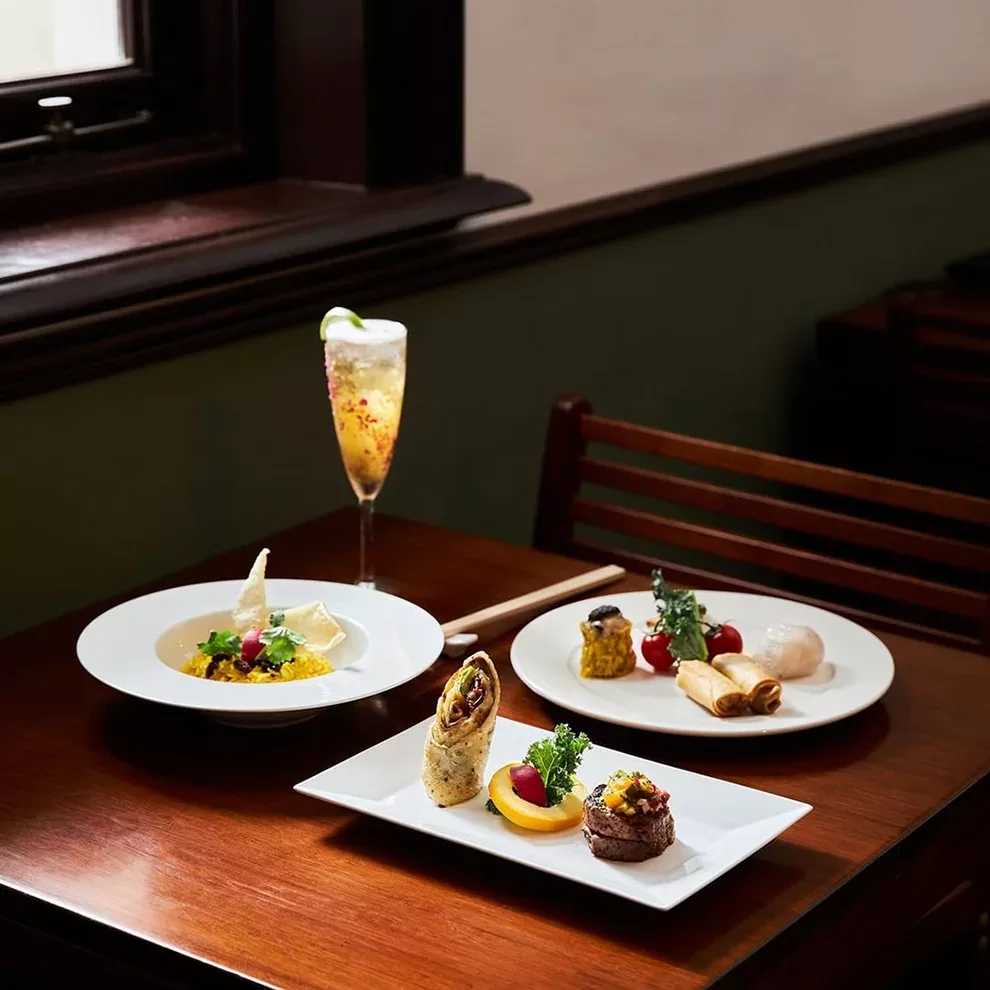 Display of vegetarian dim sum dishes served with a cocktail at Lok Cha Teahouse, Hong Kong