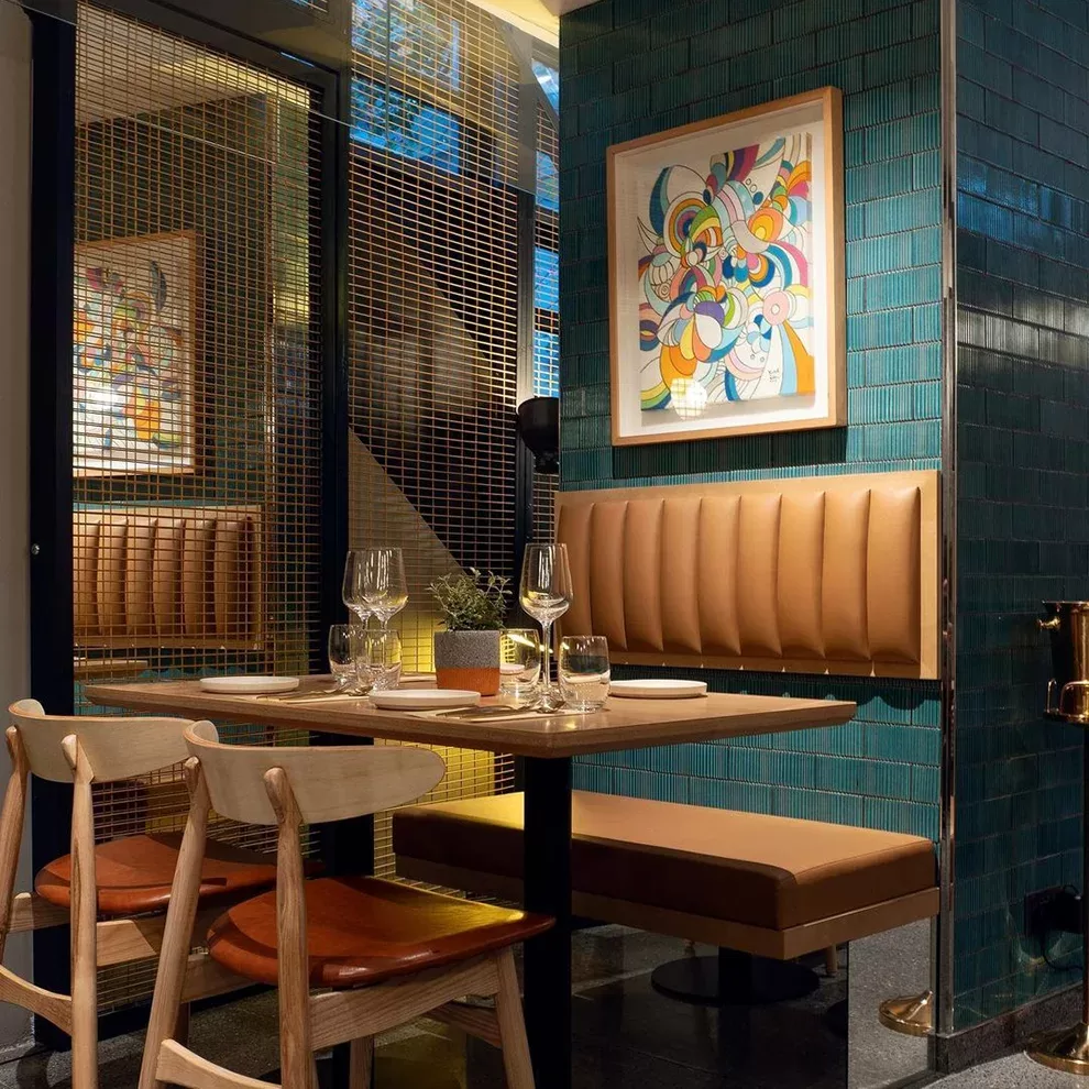 Colourful and contemporary dining booth interior at Veda at Ovolo Central, Hong Kong