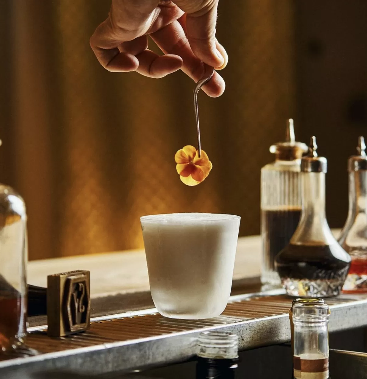 Cocktail being garnished at Le Syndicat, Paris