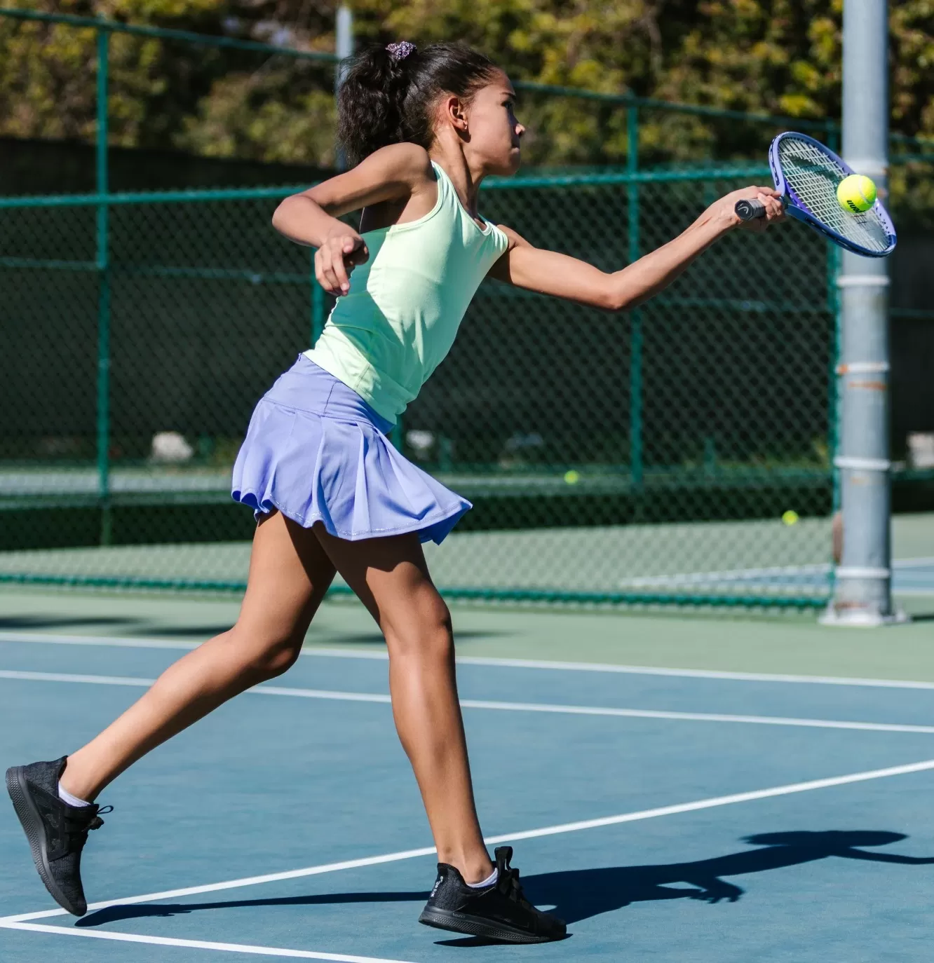 Girl playing tennis at Johnathan Markson Tennis, UK