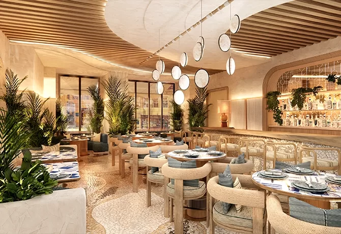 A stylish, modern restaurant interior with wooden furniture, circular tables, hanging circular lights, lush green plants, and a well-lit bar in the background. Natural light streams in through large windows.
