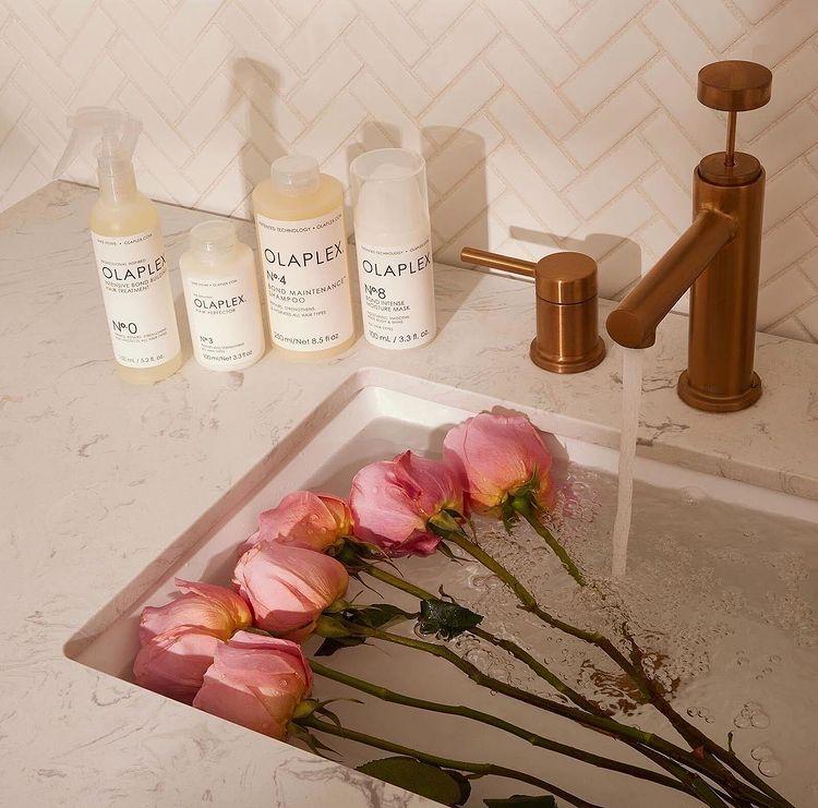 Olaplex bottles with rose petal sink