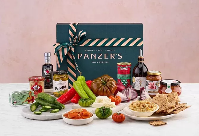 Colourful plates of Mediterranean food laid out surrounding Panzers Mediterranean Style Brunch Box