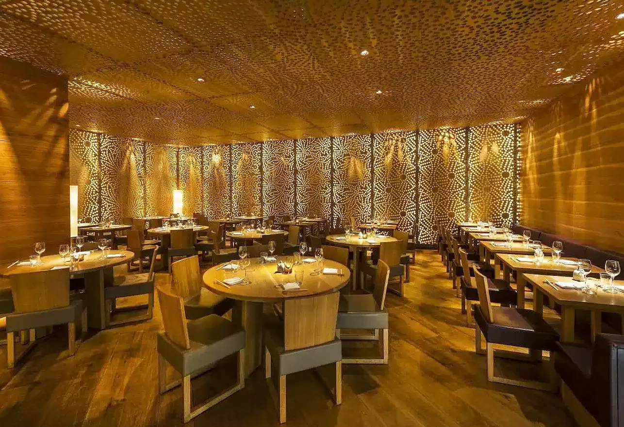 Luxury golden restaurant interior of Roka, Canary Wharf, London