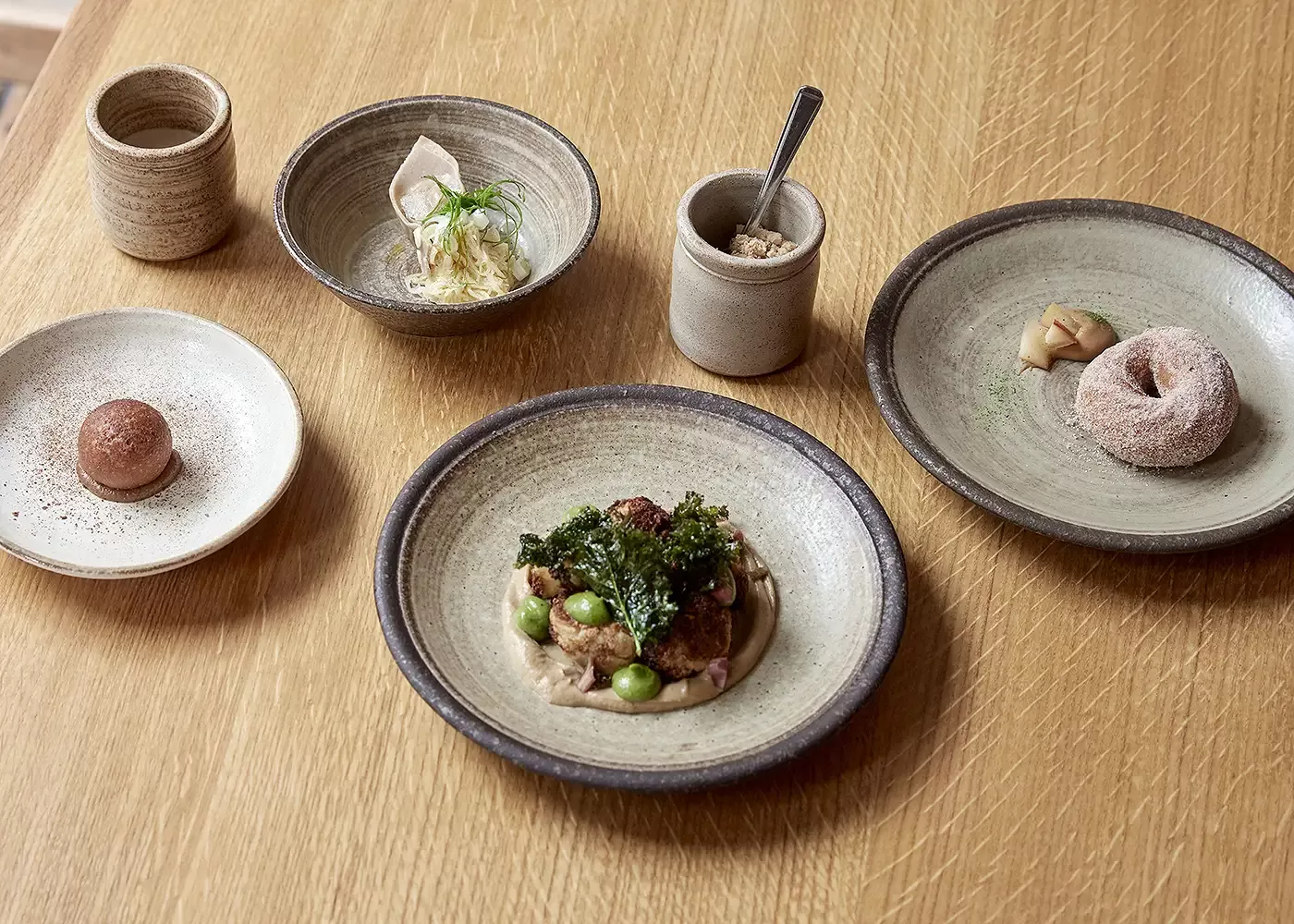 Selection of dishes displayed in plates at Apricity, London