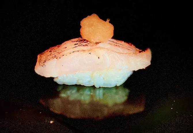 Rice sushi with salmon on top