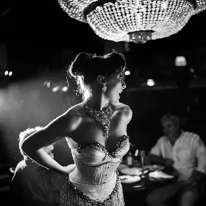 Cabaret performer in costume at luxury restaurant The Maine, Mayfair, London